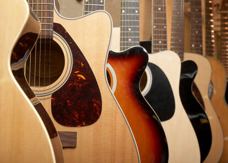 Guitars hanging on wall of music studioの写真素材