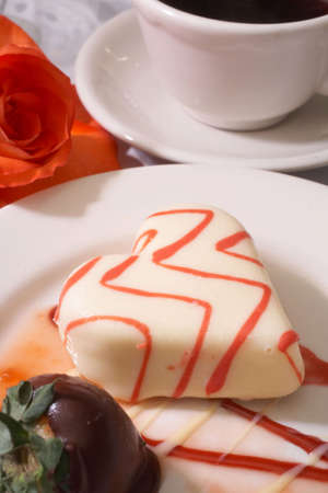 Frosted heart cake at formal table settingの写真素材