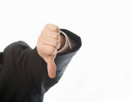 Hand of man in suit giving thumbs down sign