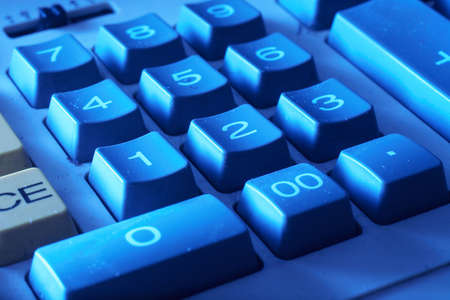 Background of closeup of numbers on calculator keypadの写真素材