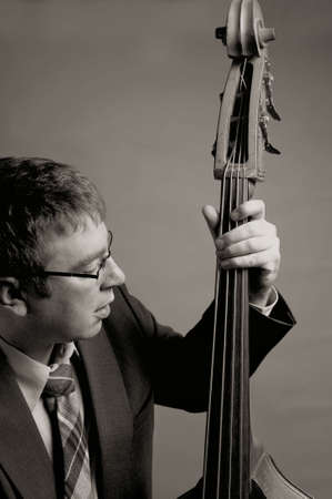 Jazz musician playing upright bass in black and whiteの写真素材