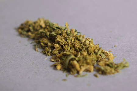 Marijuana prepared on a flat surface to assemble tobacco and smoke