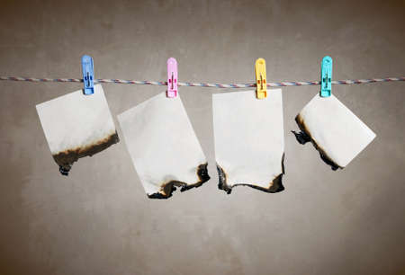 Wet burnt papers on cord 