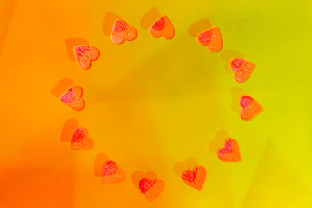 Abstraction yellow with red hearts in a circle 