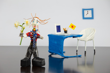 Daniel office worker in a red polka dot shirt and tie giving flowers Narcissuses の写真素材