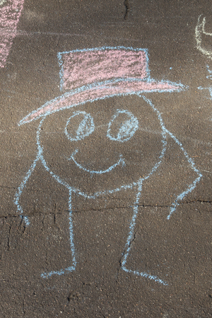 man in a hat drawn with chalk on asphaltのeditorial素材