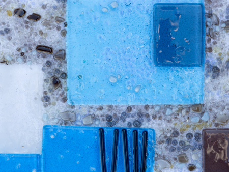 abstract blue and gray colored glass with a beautiful crumbの写真素材