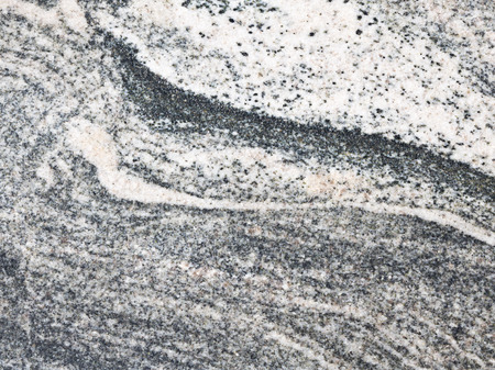 mottled gray granite with black streaks and light spotsの写真素材