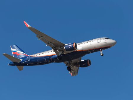 Sheremetyevo Airport -14 March 2015: Airbus A320 B. Petrovsky, Russian airline Aeroflot flies in blue sky March 14, 2015, Sheremetyevo Airport, Moscow Region, Russiaのeditorial素材