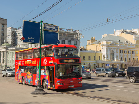 Moscow - April 12, 2015: red double-decker tourist bus stands in a parking lot waiting for tourists landing in Moscow April 12, 2015, Moscow, Russiaのeditorial素材