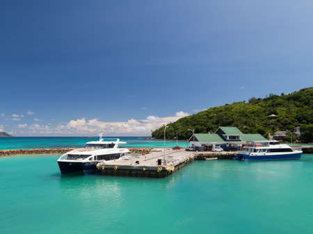 Praslin - November 10, 2014: Passenger ferries are on the dock at the port of exotic island November 10, 2014, Proaslin, Seychellesのeditorial素材