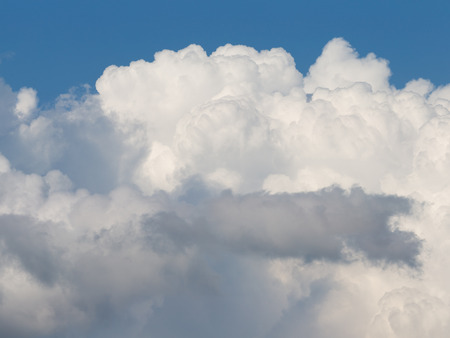 beautiful big white fluffy cumulus clouds on a blue sky background