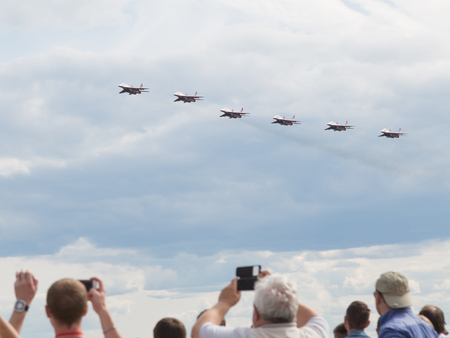 The Moscow region - 17 June 2015: many people admired and photographed Swifts aerobatic team in the international military-technical forum "Army 2015" at the airfield Kubinka June 17, 2015, Moscow Region, Russiaのeditorial素材