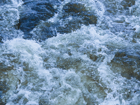a powerful stream of clear water bubbling and splashing splashing splashes and drops