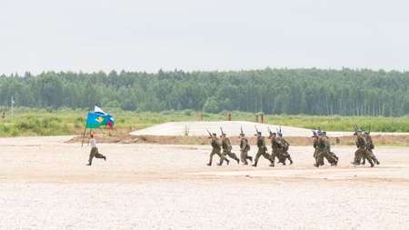 The Moscow region - 19 June 2015: The spectacular performance of Russian paratroopers with two flags on international military-technical forum "Army 2015" June 19, 2015, Moscow Region, Russiaのeditorial素材