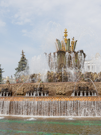 Moscow - August 13, 2015: Very unusual historic fountain Stone Flower with elements of gold and colored mosaics on ENEA in the summer of August 13, 2015, Moscow, Russiaのeditorial素材
