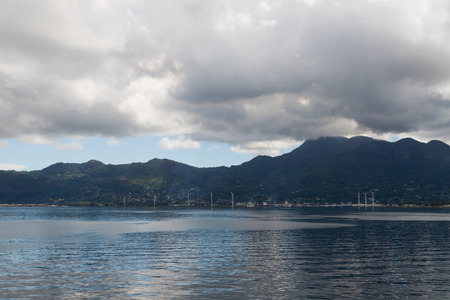 Seychelles - 10 November 2014: View of the capital of the Seychelles - the city of Victoria from the ocean on a cloudy day November 10, 2014, Victoria, Mahe, Seychellesのeditorial素材