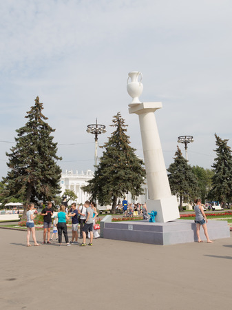 Moscow - August 13, 2015: Installation Falling column of "fragility" Rostand Tavasieva ENEA in the park and people are walking around in good weather, August 13, 2015, Moscow, Russiaのeditorial素材