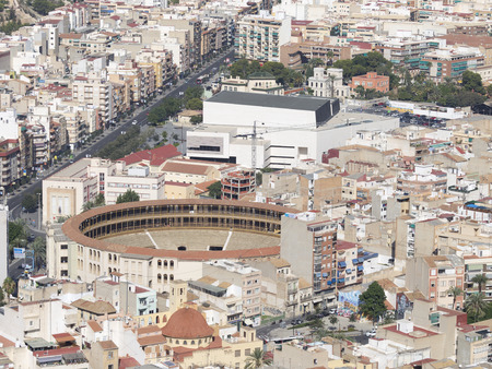 Alicante - 4 October 2015: Aerial view of the residential areas, paved roads and bullring of the tourist city of Alicante October 4, 2015, Alicante, Spainのeditorial素材
