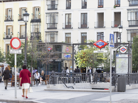 Madrid - 7 October 2015: Opera metro stations in Madrid and people walk and relax next to the station October 7, 2015, Madrid, Spainのeditorial素材