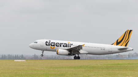 Sydney - February 26, 2016: A passenger plane airbus A320 Tiger Airways landing at the airport in Sydney February 26, 2016, Sydney, Australiaのeditorial素材