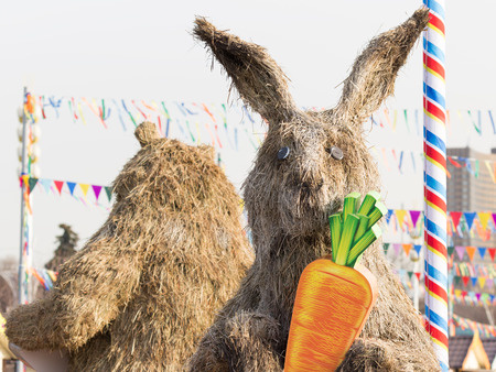 Moscow - March 11, 2016: Bright cheerful and festive Mardi Gras straw stuffed rabbit at the fair ENEA 11 March 2016, Moscow, Russiaのeditorial素材