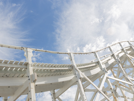 beautiful abstraction of a white wooden structure of the old road, leaving in the blue sky with white cumulus and cirrus cloudsの写真素材