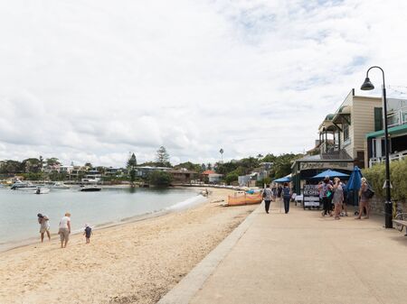 Sydney - March 1, 2016: Sydney beach promenade and people walk and relax by the sea water Sydney Harbour March 1, 2016, Sydney, Australiaのeditorial素材