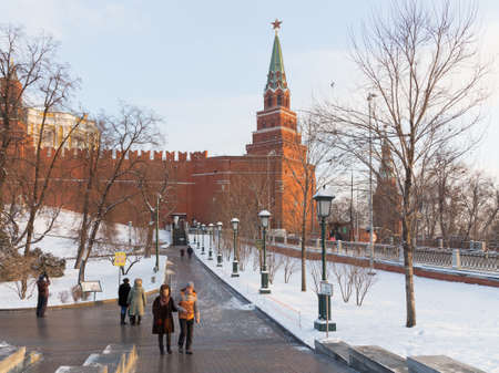 Moscow - January 7, 2016: A lot of people walk around the Kremlin walls in the Alexander Garden winter and white snow in the Park January 7, 2016, Moscow, Russiaのeditorial素材