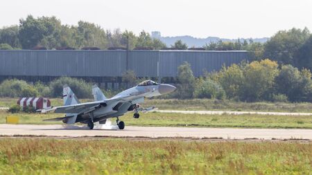 MOSCOW - 09.09.2019: A new powerful military aircraft Su-35 fighter in the sky at MAX-2019 lands,...