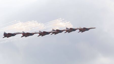 MOSCOW - 09.09.2019: Powerful military aircraft MiG-29 fighters of the Swifts aerobatic team in the sky at MAX-2019 welcomes spectators with a salute, 09/09/2019, Moscow, Russiaのeditorial素材