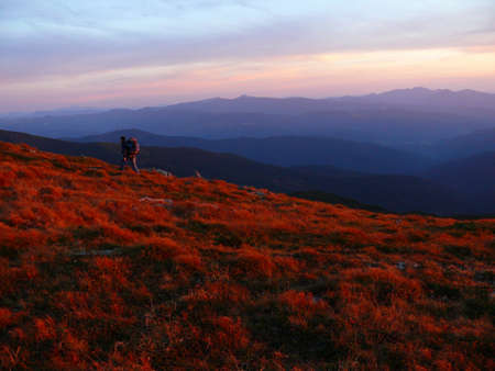 Very beautiful sunset in the mountains and on the field.