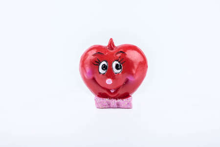Toy in the form of heart with eyes on white の写真素材