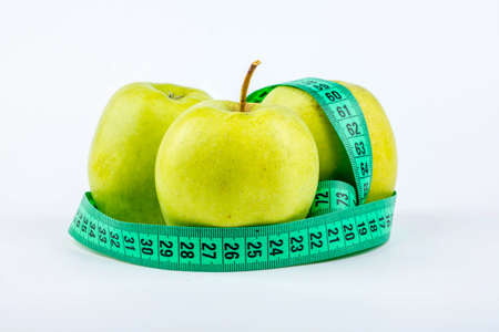Three green apple with meter on white の写真素材