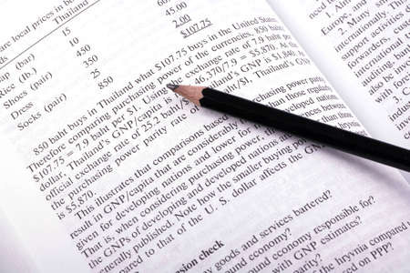 Open book on business and black pencilの写真素材