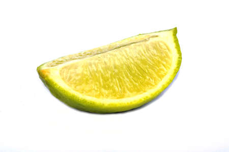 Cut a piece of lime on white の写真素材