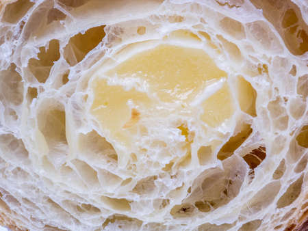 Cut croissant with cream shot closeupの写真素材