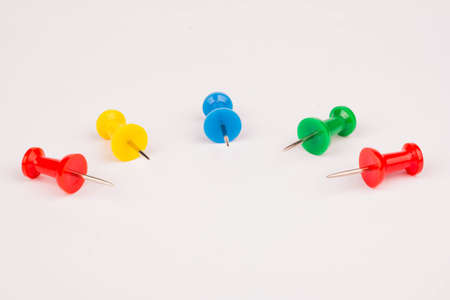 Five pushpin laid out in a semicircleの写真素材