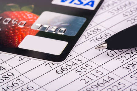Financial report, a credit card and penのeditorial素材