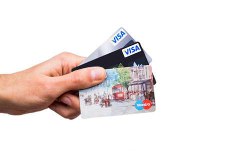 Three credit card in mans hand