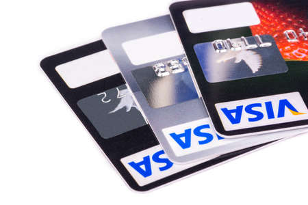 Three credit cards Visa lie on each other