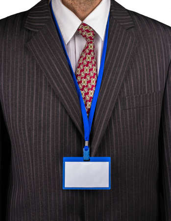 Manager in a suit with a tie and a badge on the neckの写真素材