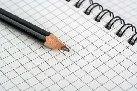 Pencil lying on an open notebook pagesの写真素材
