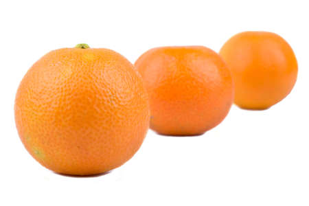 Four fruit mandarin lie one behind the otherの写真素材