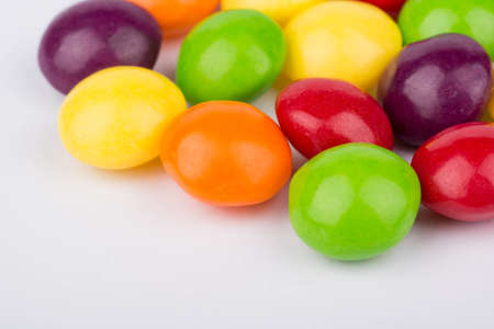 Scattered multicolored candy close-up shotの写真素材