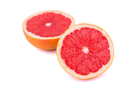 Two halves cut grapefruit on a white backgroundの写真素材