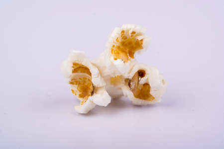 One popcorn filmed close-up on a gray backgroundの写真素材