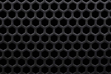Black background metal grate with holes