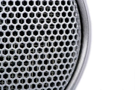 Microphone grille shot close up on a white backgroundの写真素材