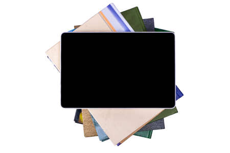 E-book lies on a pile of booksの写真素材